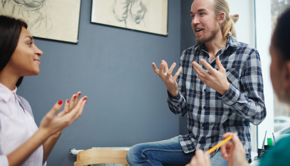 A group of young people having an engaged discussion.